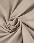 Stretch beige cotton stiff fabric. High-quality deadstock fabric collected in Stock from a Maison de Couture in Italy.