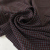 Pure viscose with a check pattern in the shades of black, red, and white. Very soft, flowy, and not transparent. Ideal for skirts and dresses. High-quality deadstock collected in Stock from a Maison de Couture in Italy.