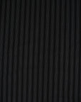 Fabric in black chalk stripe with fine white lines, elegant and slightly structured. Ideal for tailoring, trousers, jackets and skirts. High-quality deadstock collected in Stock from a Maison de Couture in Italy.
