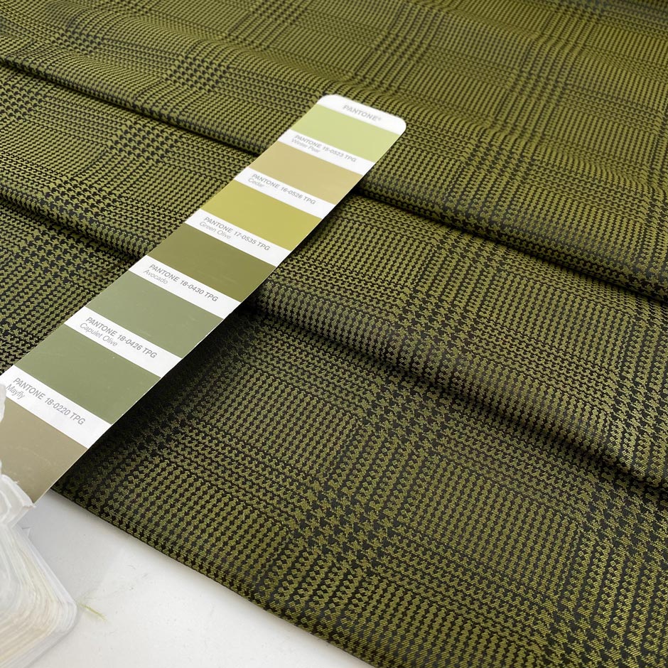 Soft tafta in polyester in olive green with prince of Wales design. High-quality deadstock fabric collected in Stock from a Maison de Couture in Italy.