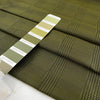 Soft tafta in polyester in olive green with prince of Wales design. High-quality deadstock fabric collected in Stock from a Maison de Couture in Italy.