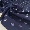 Pure structured and heavy cotton gabardine with dark blue base and geometrical print. Premium deadstock fabric from an Italian Maison de Couture."