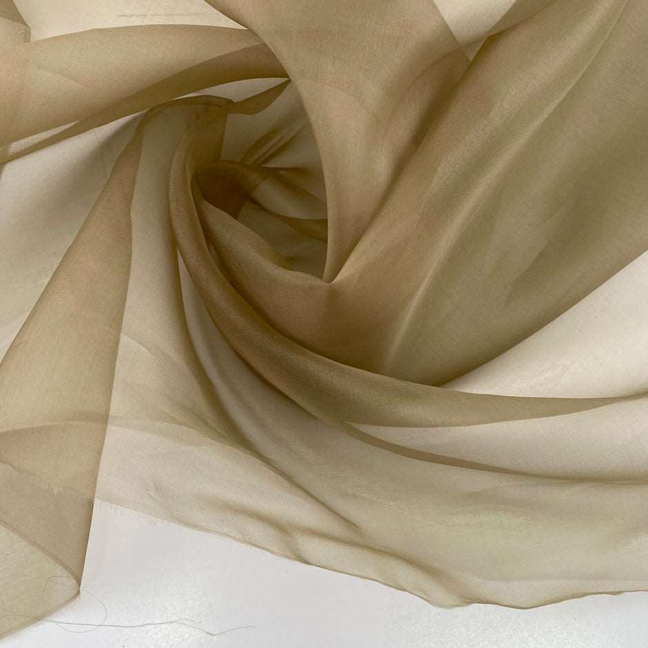 Green silk organza. It is transparent, soft and falling. High-quality deadstock fabric collected in Stock from a Maison de Couture in Italy.