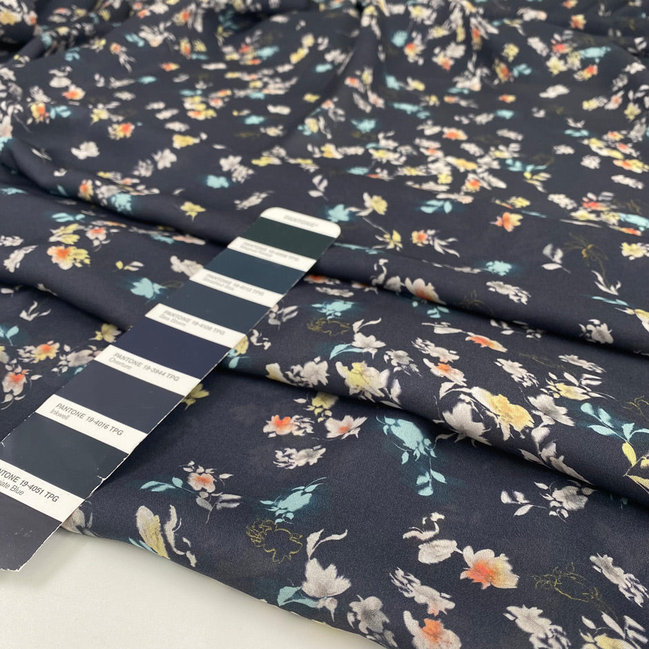 Pure silk with a subtle sheen and small floral design, dark blue base, slightly transparent. Ideal for blouses, dresses, and delicate layers. High-quality deadstock collected in Stock from a Maison de Couture in Italy.
