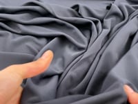 Grey plain viscose jersey . Picked up in Stock from a Maison de Couture in Italy. High quality deadstock fabric.